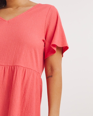 Coral Textured Peplum Top