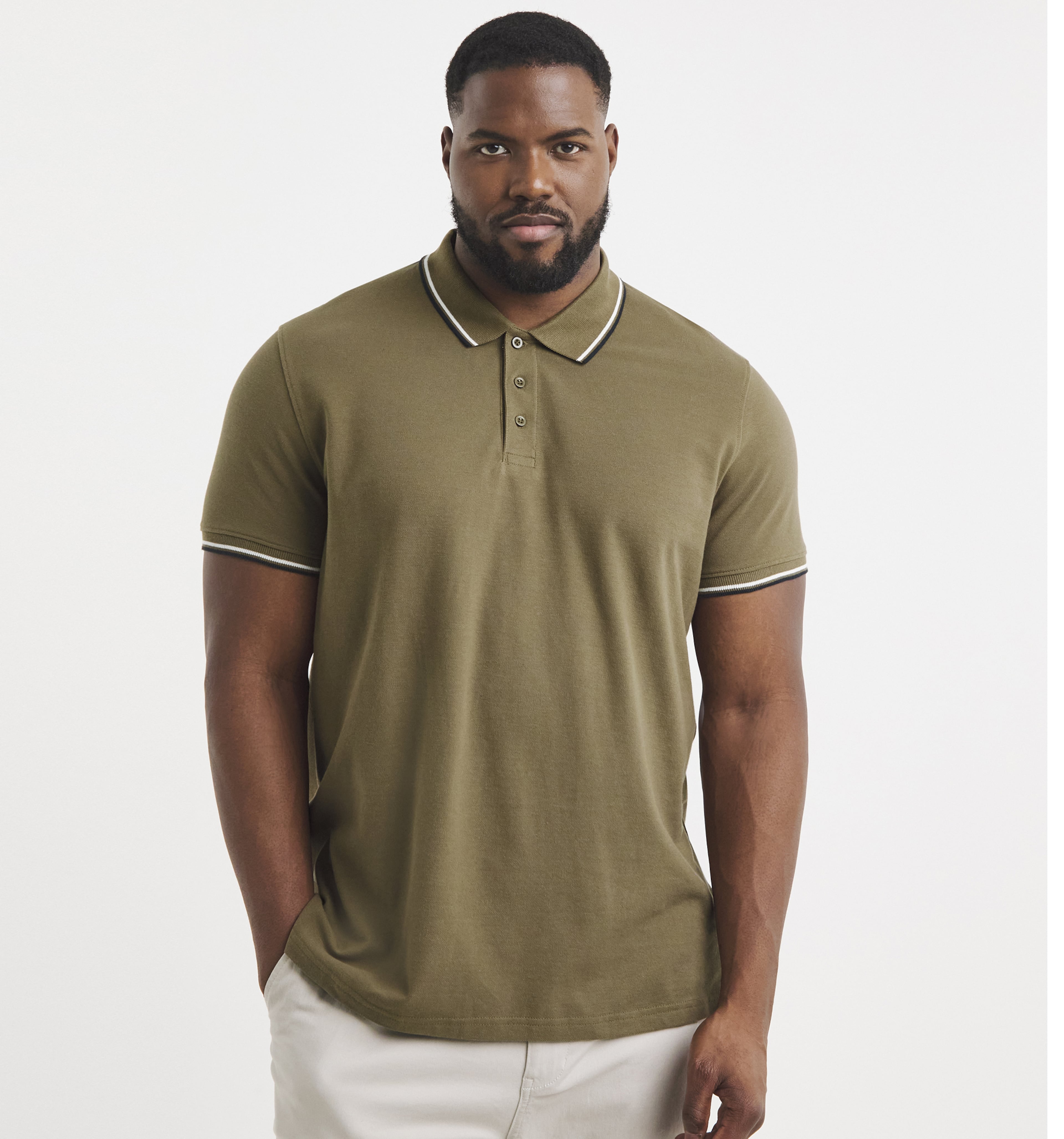 A man wearing a khaki polo shirt