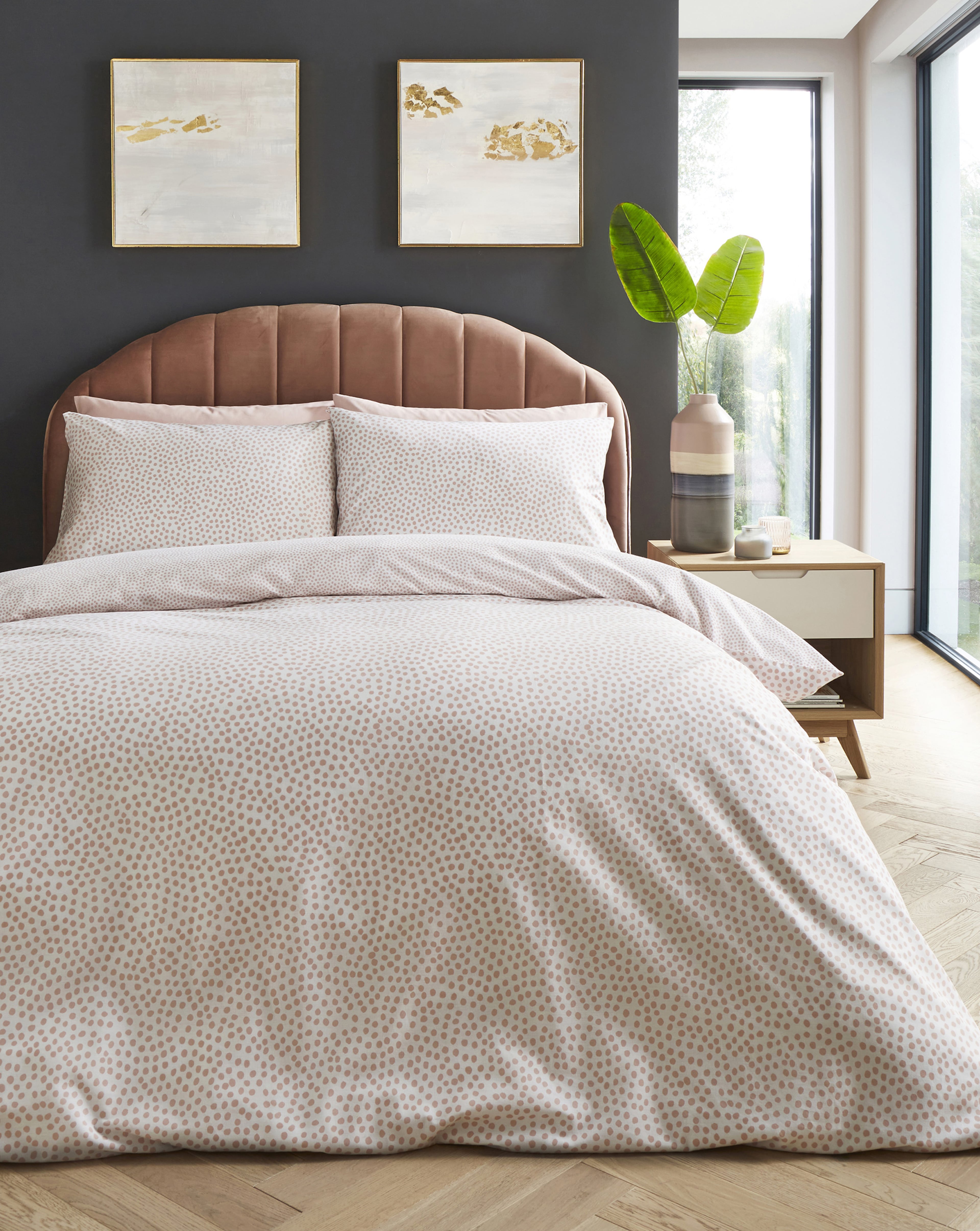 A light grey duvet set fitted to a bed