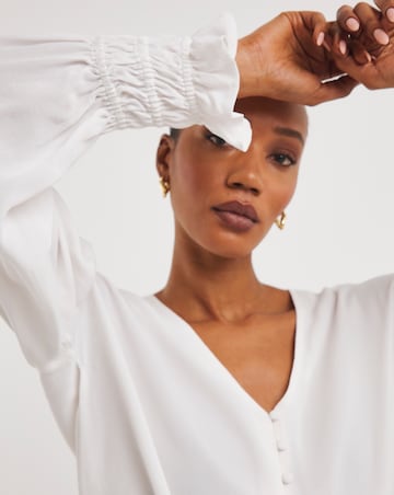Ivory Button Through Dipped Back Blouse